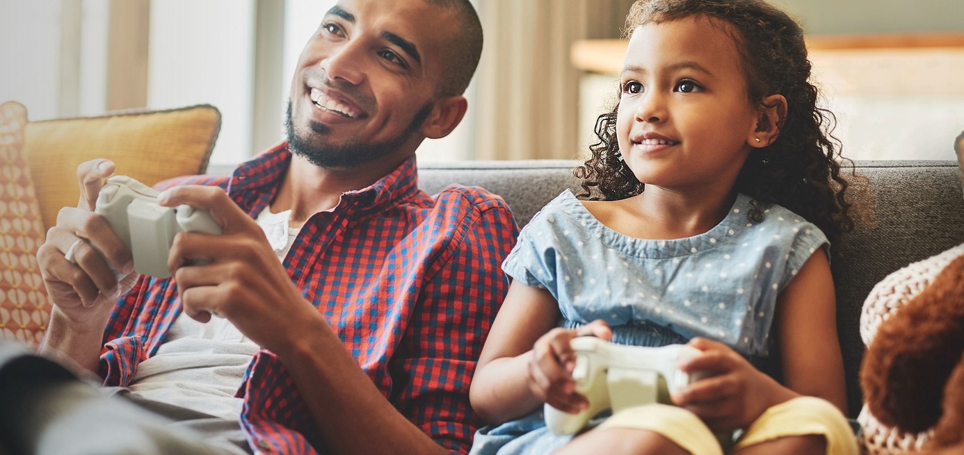 father and daughter playing video games