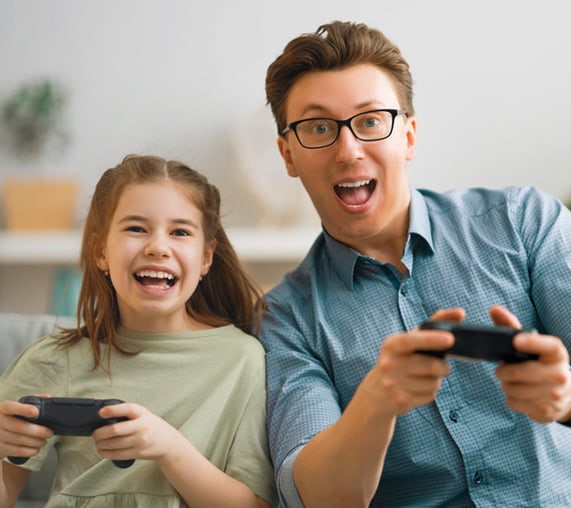 father and daughter playing video games