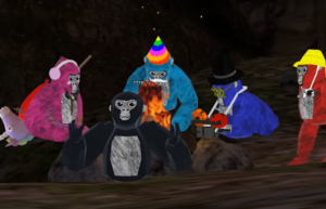 Five "monkes" sit by a campfire in a game of Gorilla Tag. From Left to right: pink monke, black monke, turquoise monke, blue monke, brown monke.